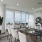 Penthouse dining room with floor to ceiling windows and wraparound terrace