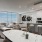 Penthouse 4003 kitchen and living area with floor to ceiling windows, private terrace, and views of South Lake Union