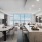 Penthouse 4003 kitchen and dining area with floor to ceiling windows, private terrace, and views of South Lake Union