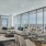 Penthouse 4004 living and dining areas with floor to ceiling windows with private wraparound terrace and views of South Lake Union.
