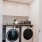 Penthouse laundry room with full-size energy efficient washer and dryer, countertop for folding, and additional storage cabinets.
