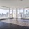 Penthouse living room with floor to ceiling windows and private wraparound terrace.