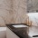 Penthouse baths include double floating vanity with quartz countertops and backlit mirror, deep soaking tub, and gold fixtures