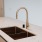 Penthouse kitchen with quartz countertops and upgraded fixtures.