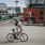 lifestyle image of a person riding a bike through a part of downtown Seattle